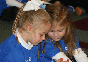 two-preschool-girls-sharing