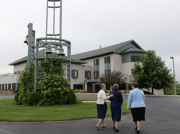 dressed-up-claudia-stef-jackie-walking-toward-monastery
